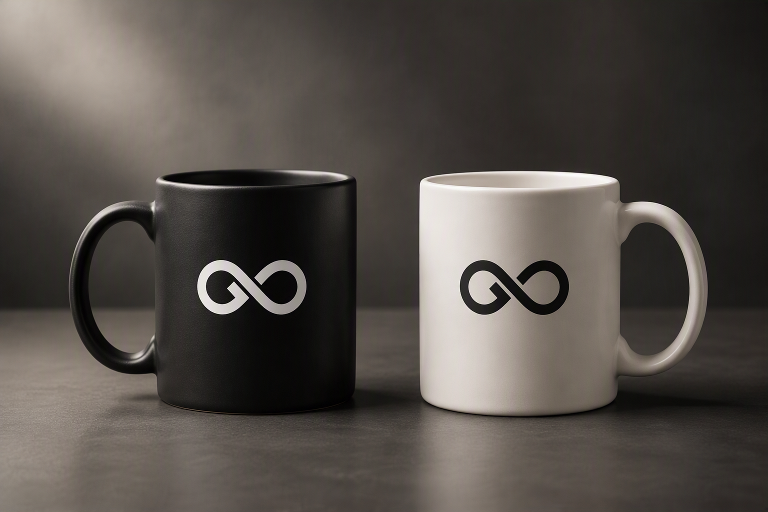Black and white coffee mugs featuring the GXD studio identity